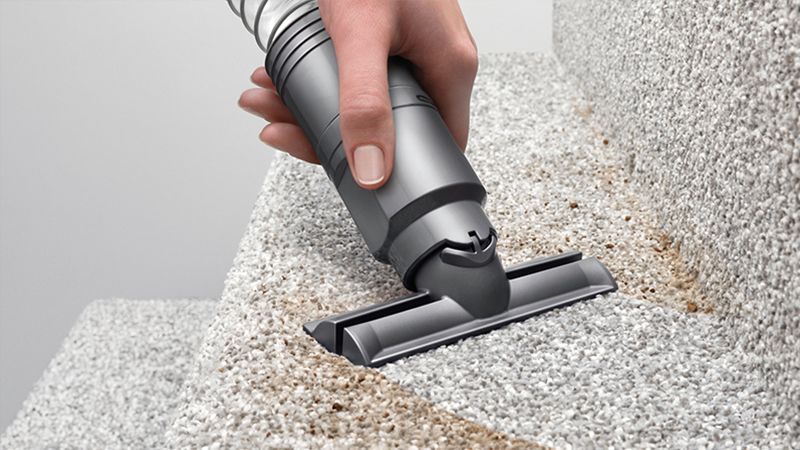 Cleaning with stair tool on stair Cleaning with stair tool on stair