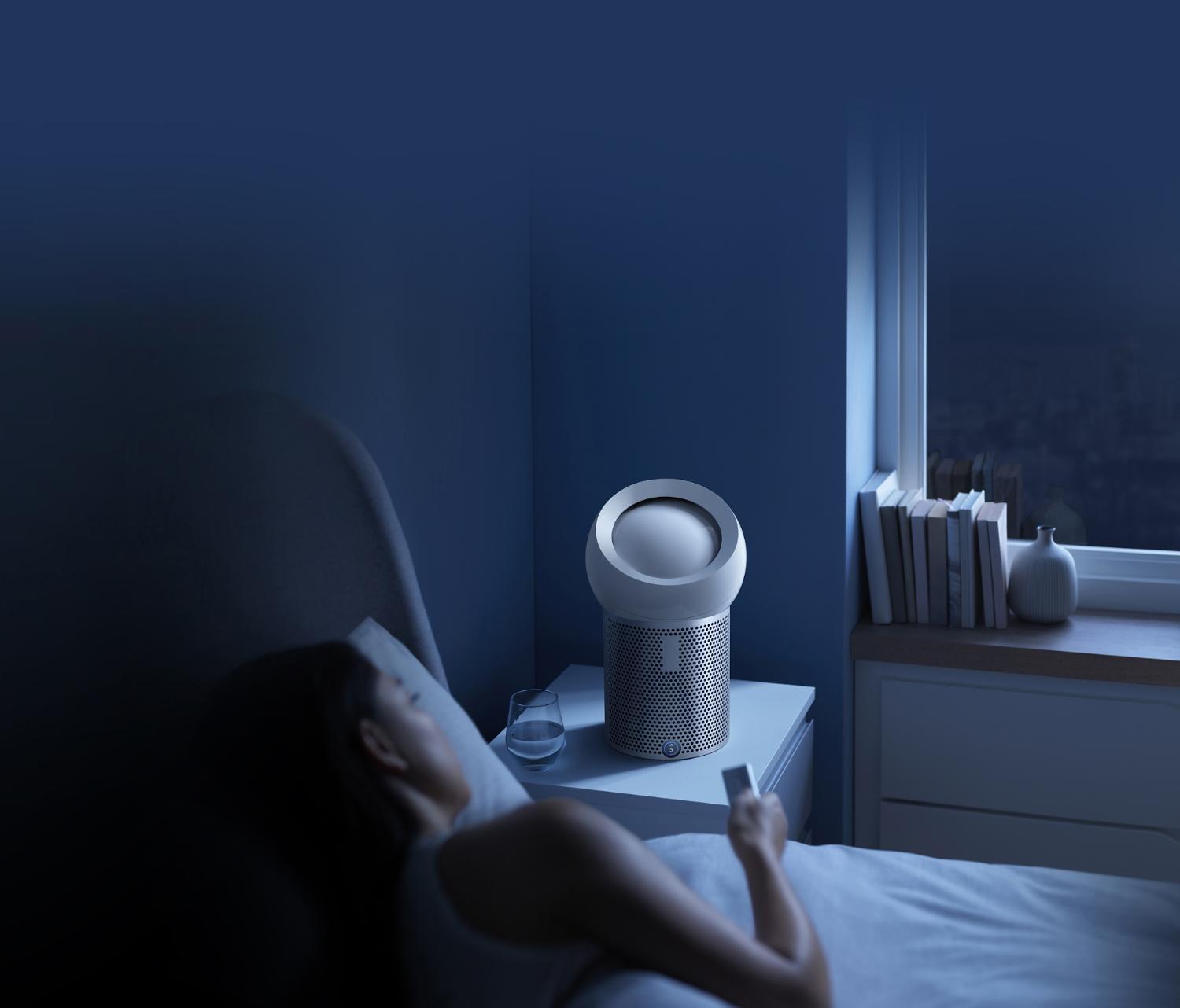 Woman being directly cooled by the Dyson Pure Cool purifier fan