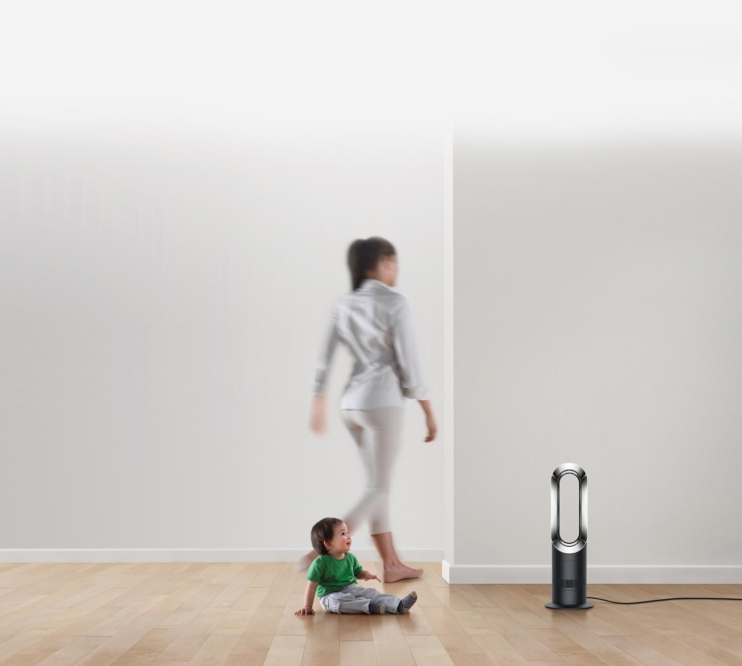 Child with Dyson fan heater