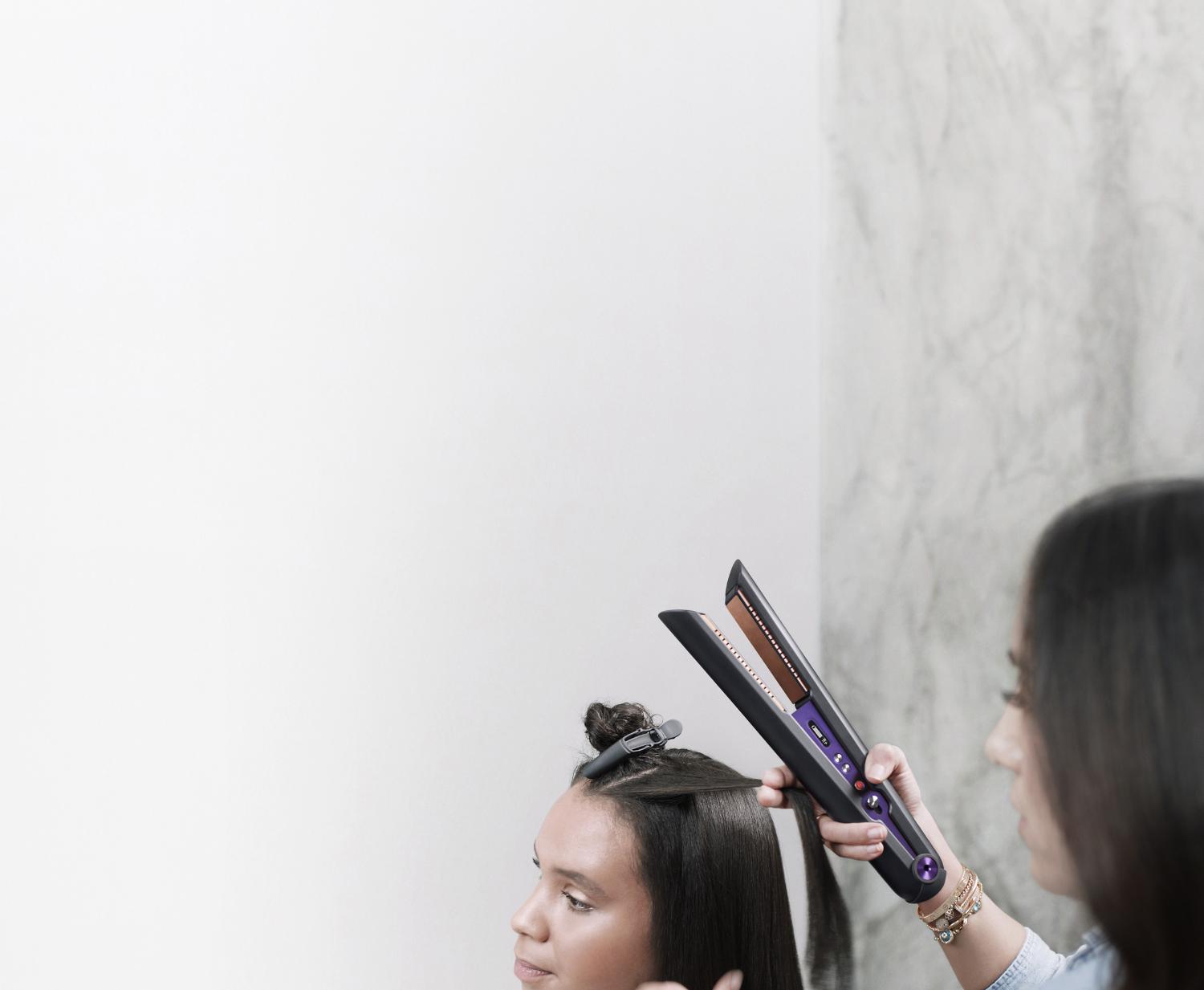 Dyson Corrale straightener being used by a hair stylist