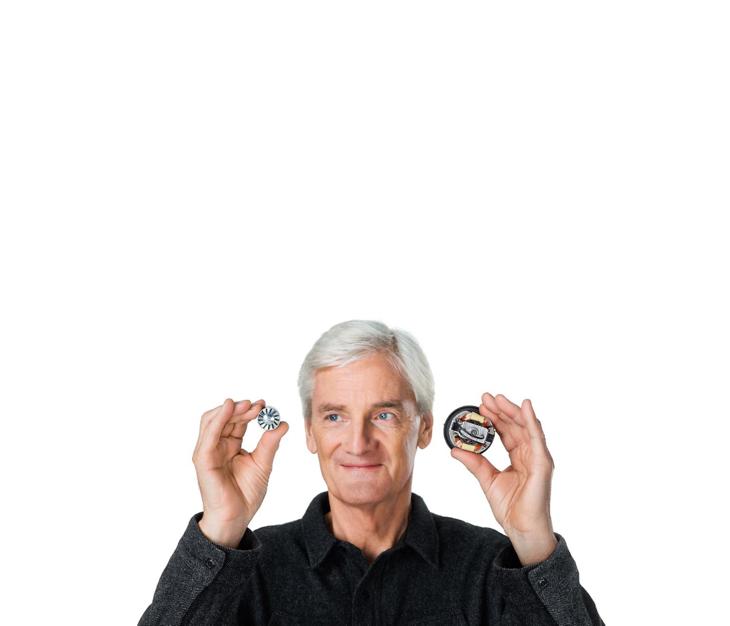 James Dyson holding motor