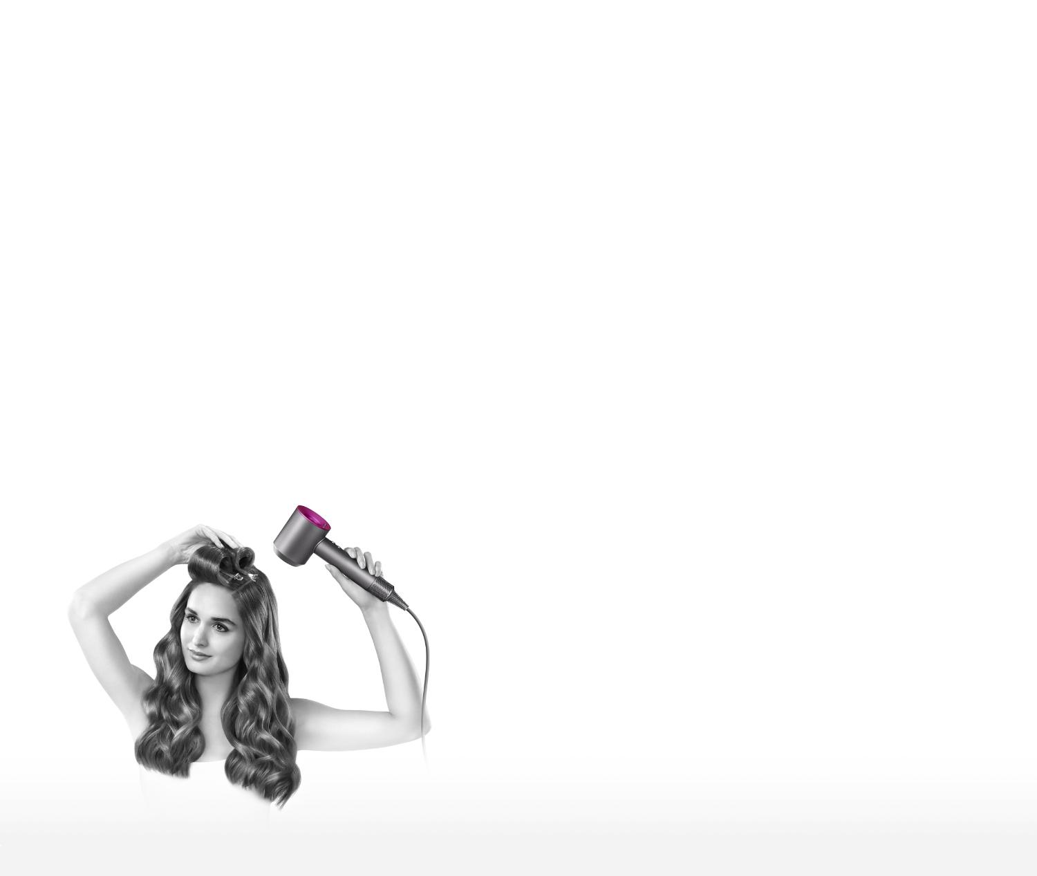 Model with Dyson Supersonic™ hair dryer