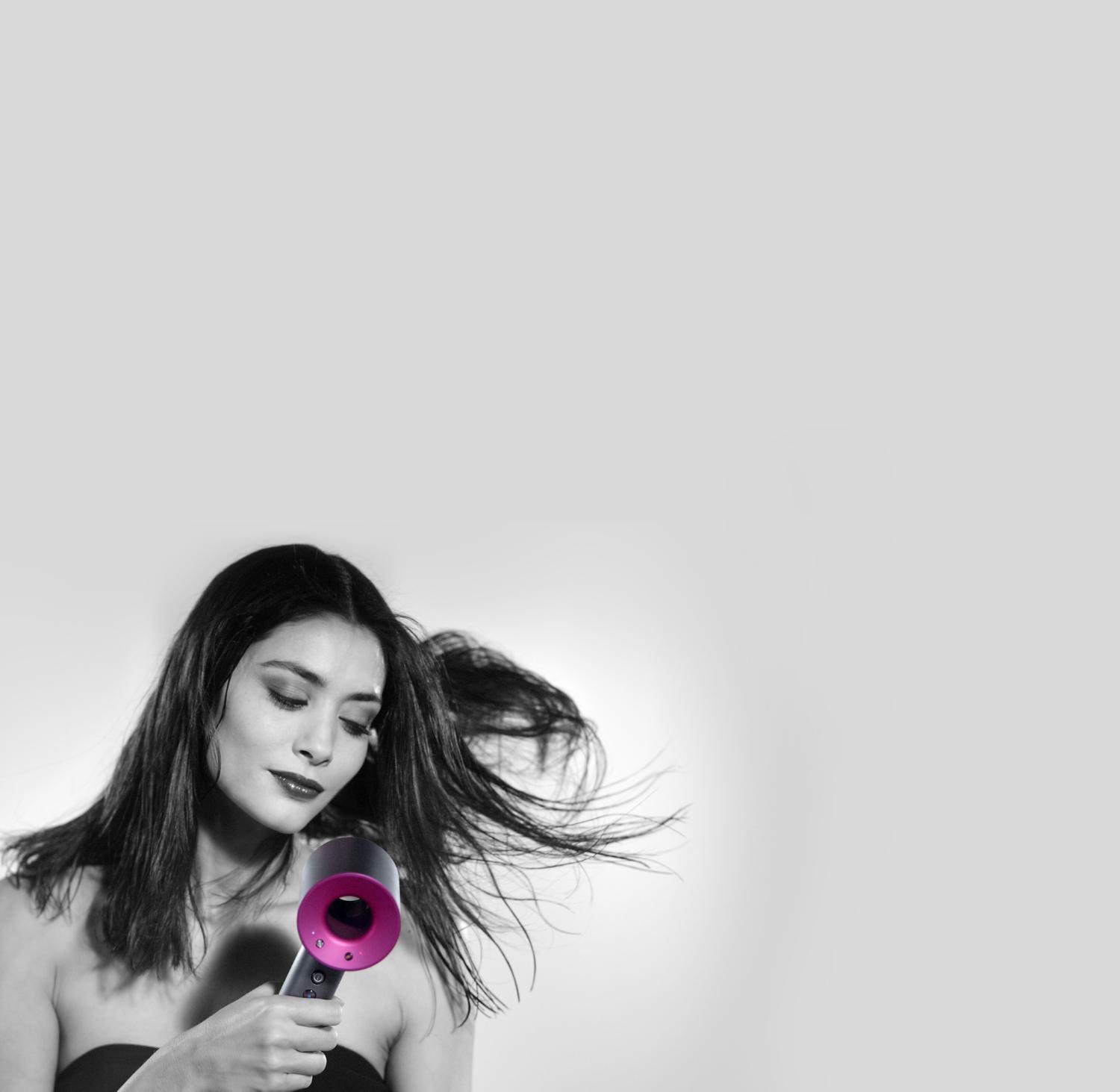 Model with Dyson Supersonic™ hair dryer