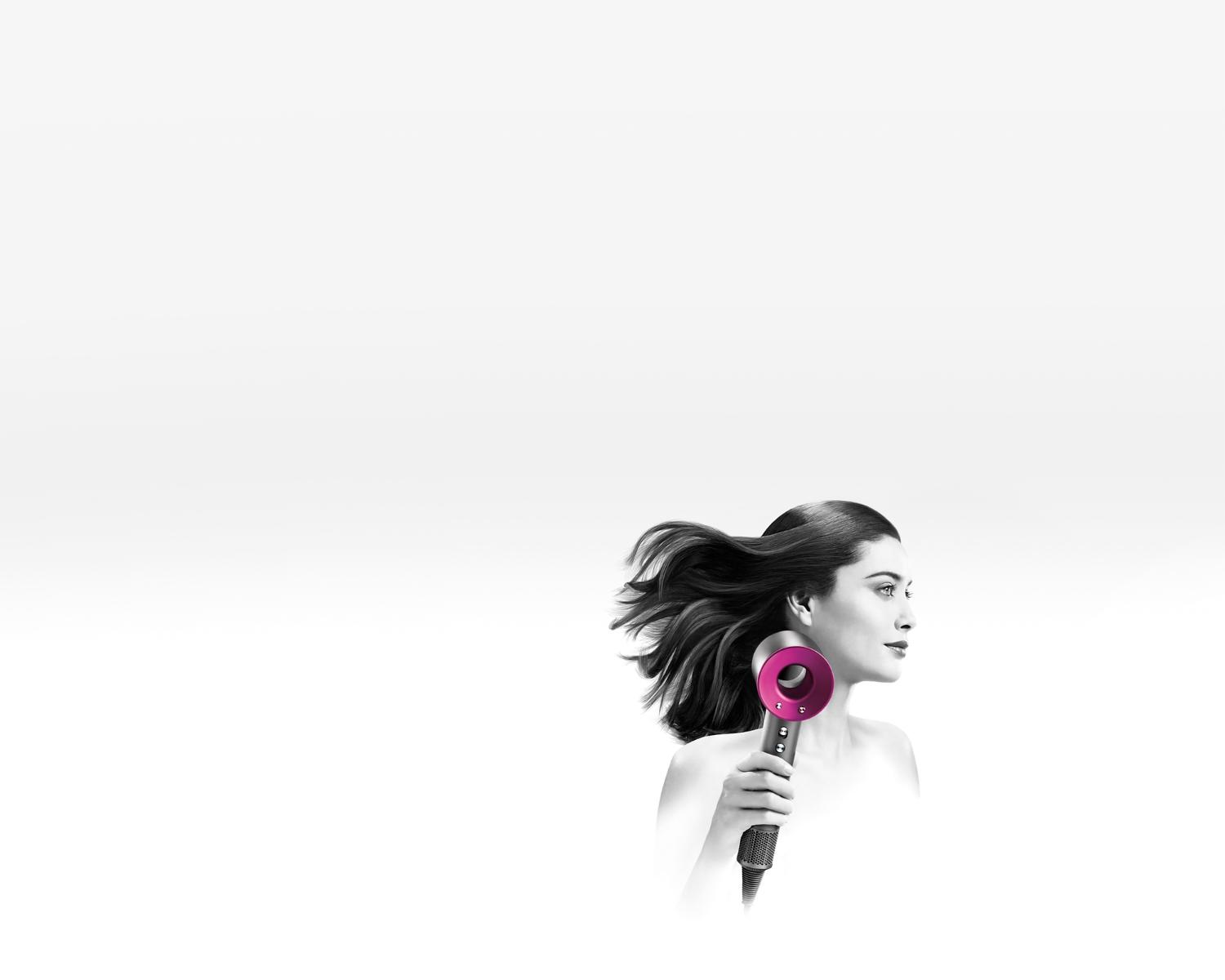 Model using Dyson Supersonic™ hair dryer