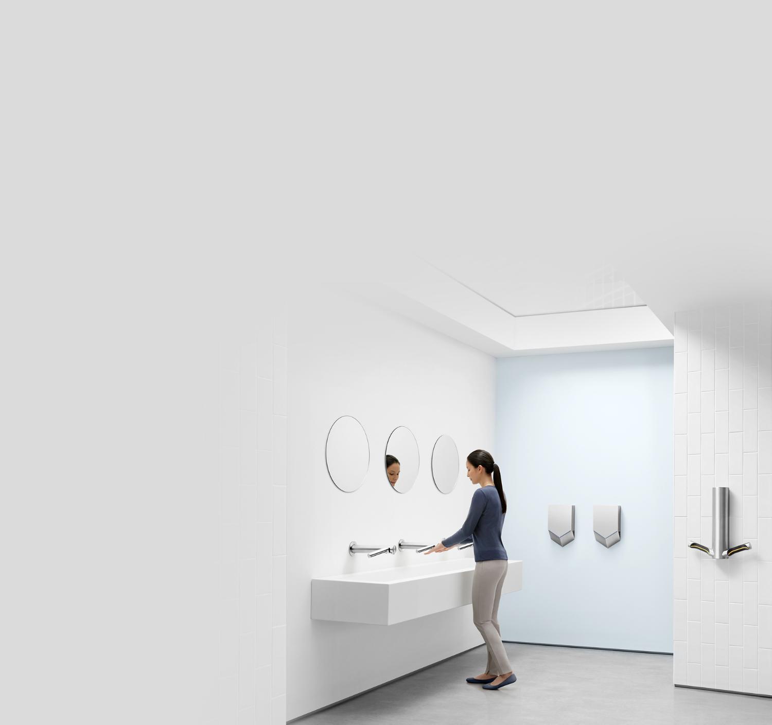 Dyson Airblade hand dryers mounted in a washroom