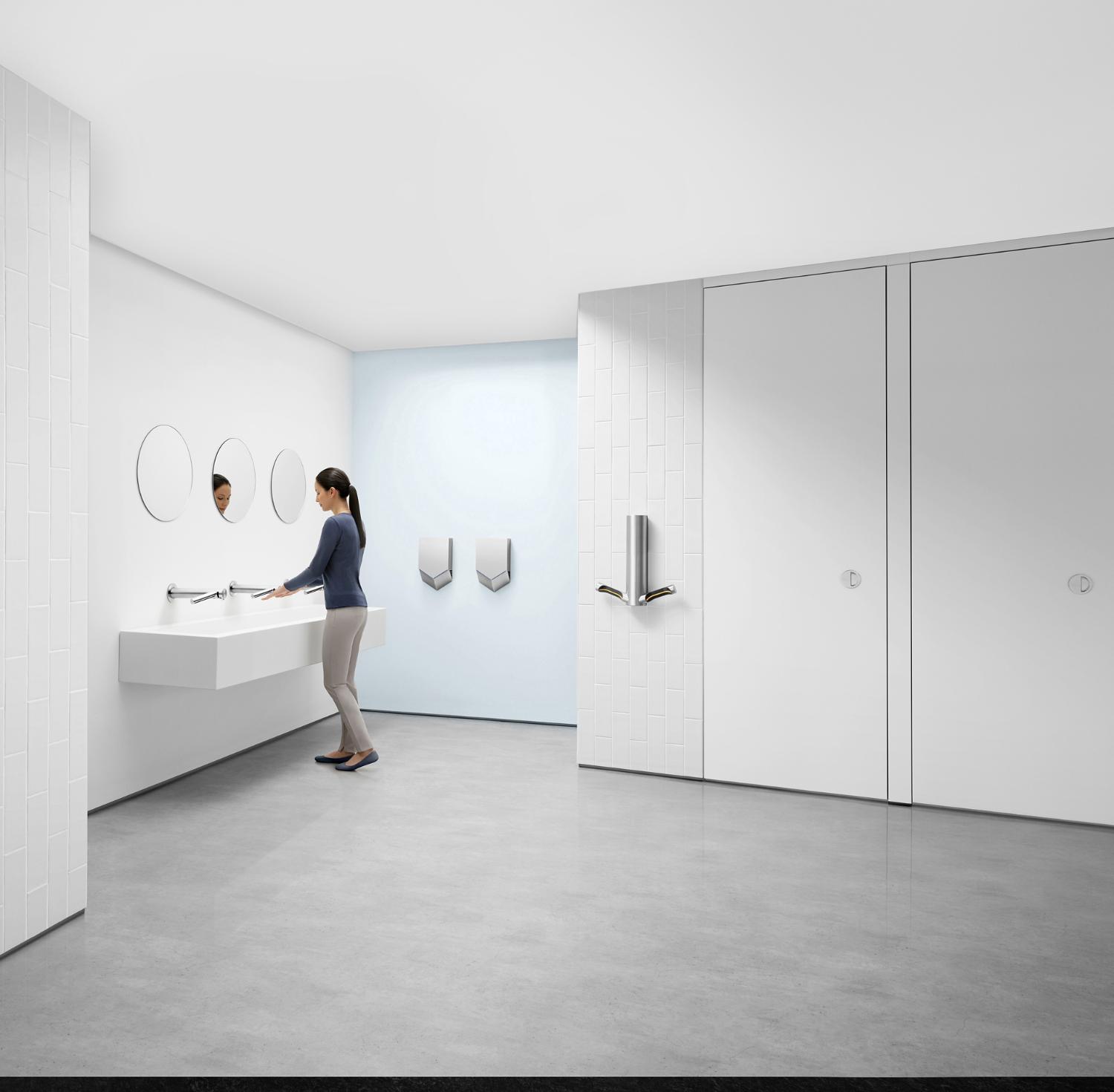 Dyson Airblade hand dryers mounted in a washroom