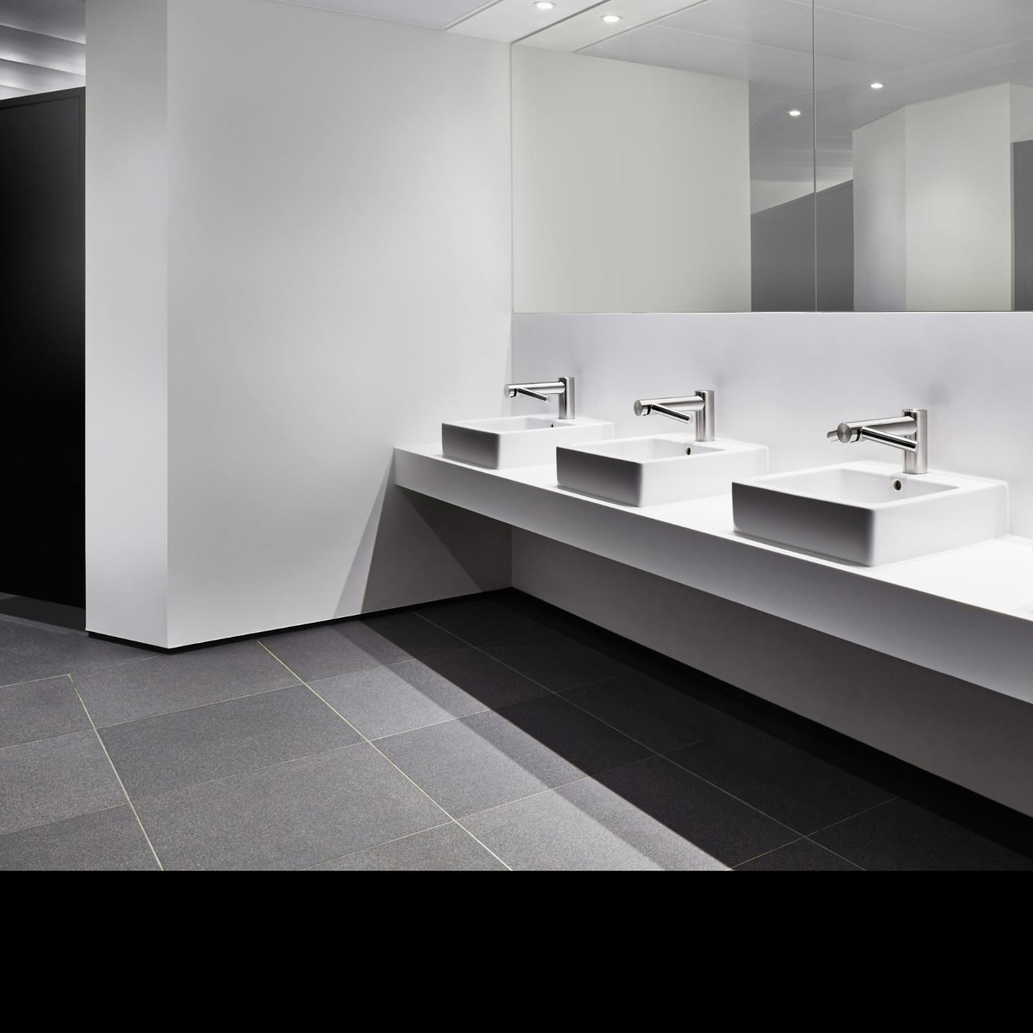 Row of Dyson Airblade Taps in bathroom