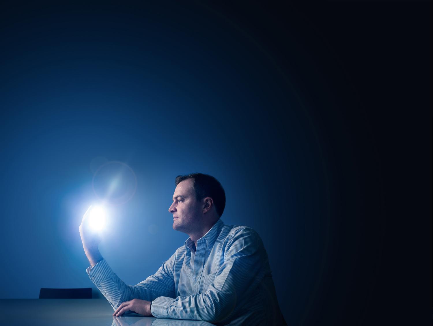 Jake Dyson holding light