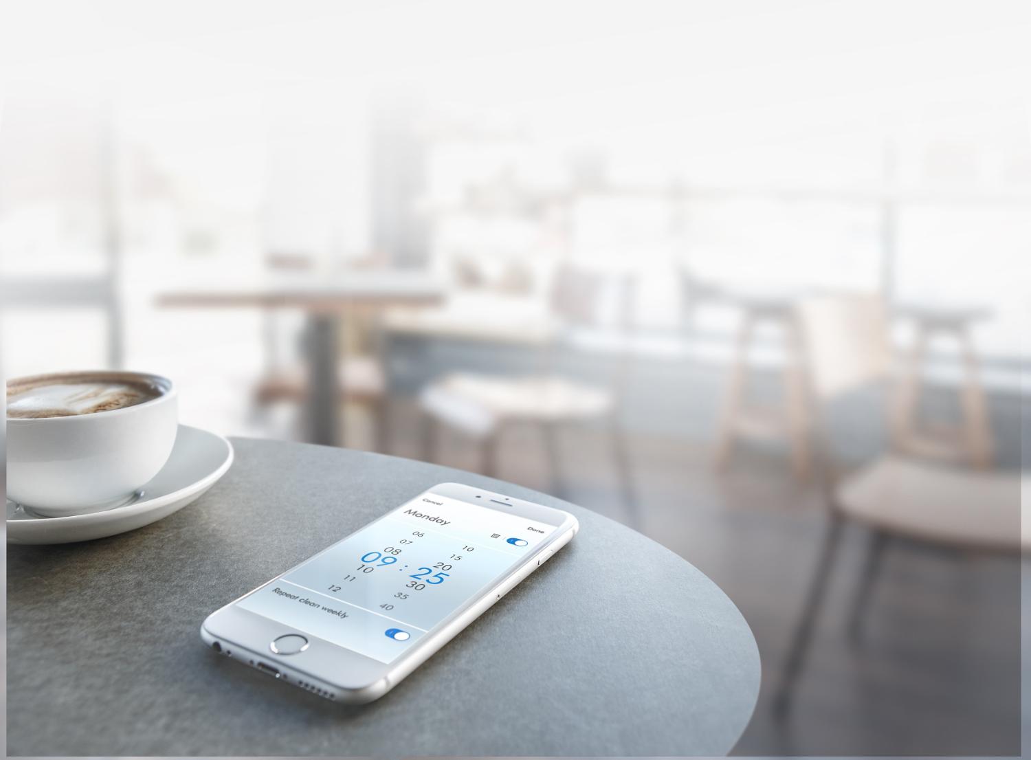 Smartphone with Dyson Link app on table