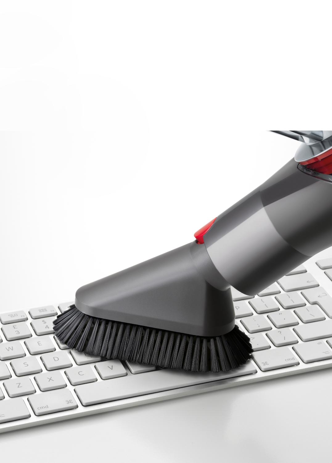 Mini-brosse douce d’époussetage à retrait rapide sur un clavier