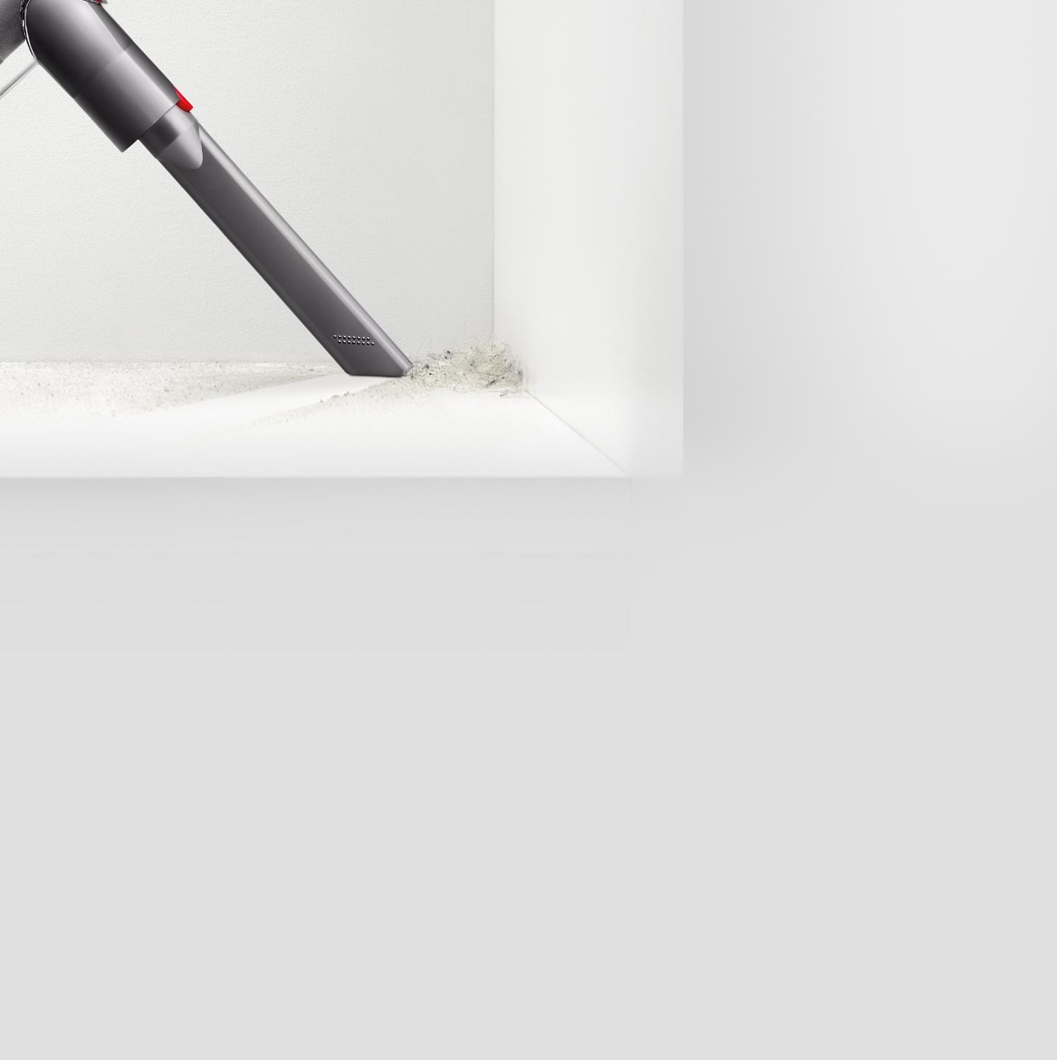 Quick release crevice tool picking up dirt from hard to reach area
