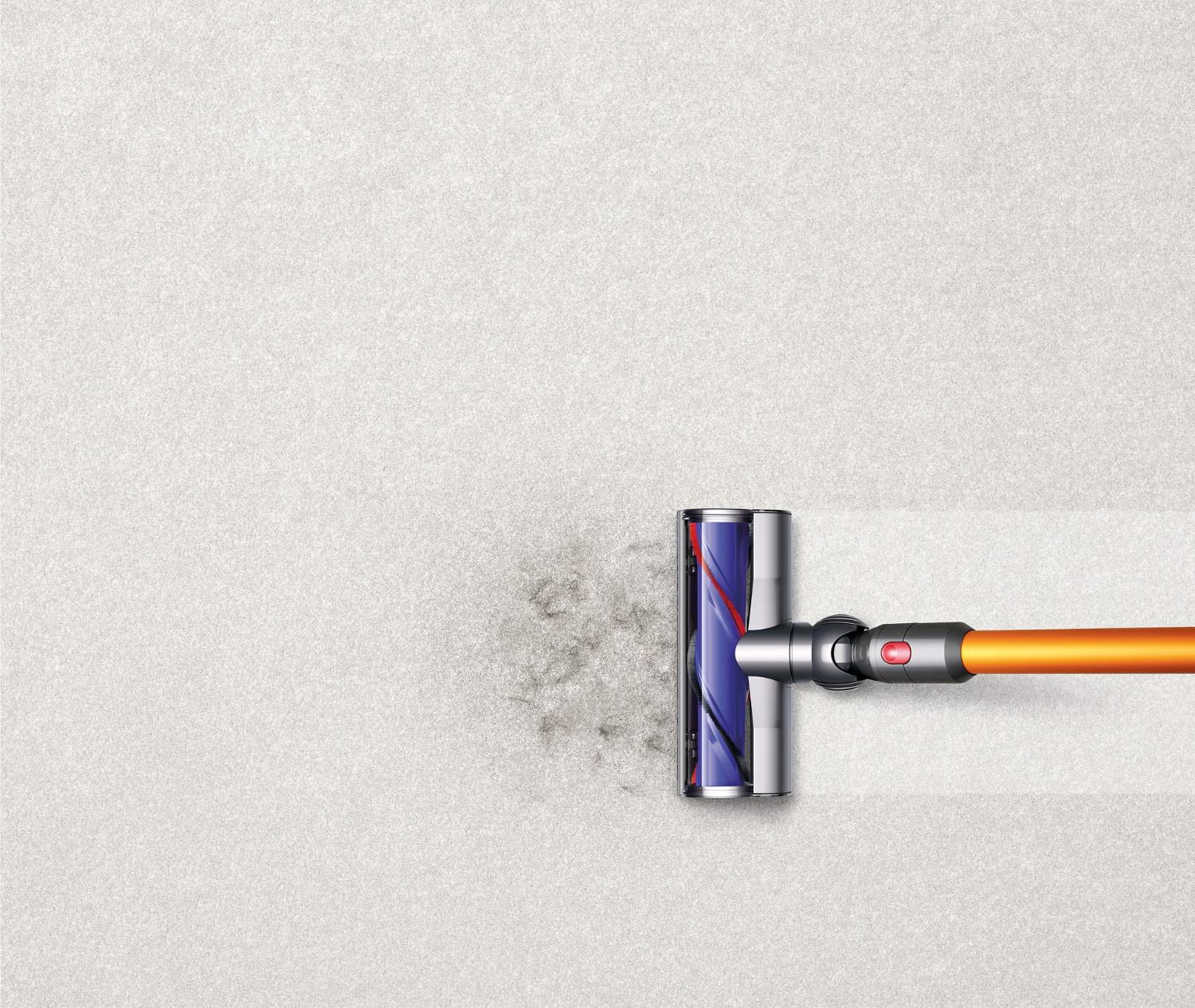 Close up of Soft roller cleaner head picking debris up off the floor.