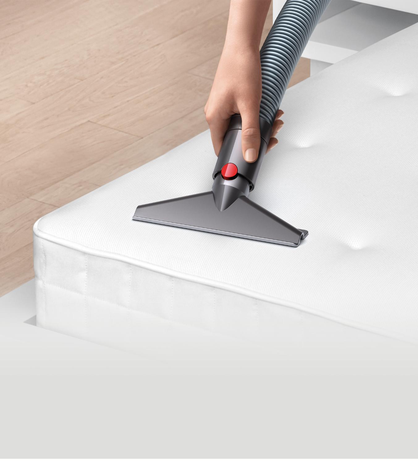 Quick-release wide nozzle tool being used on a mattress