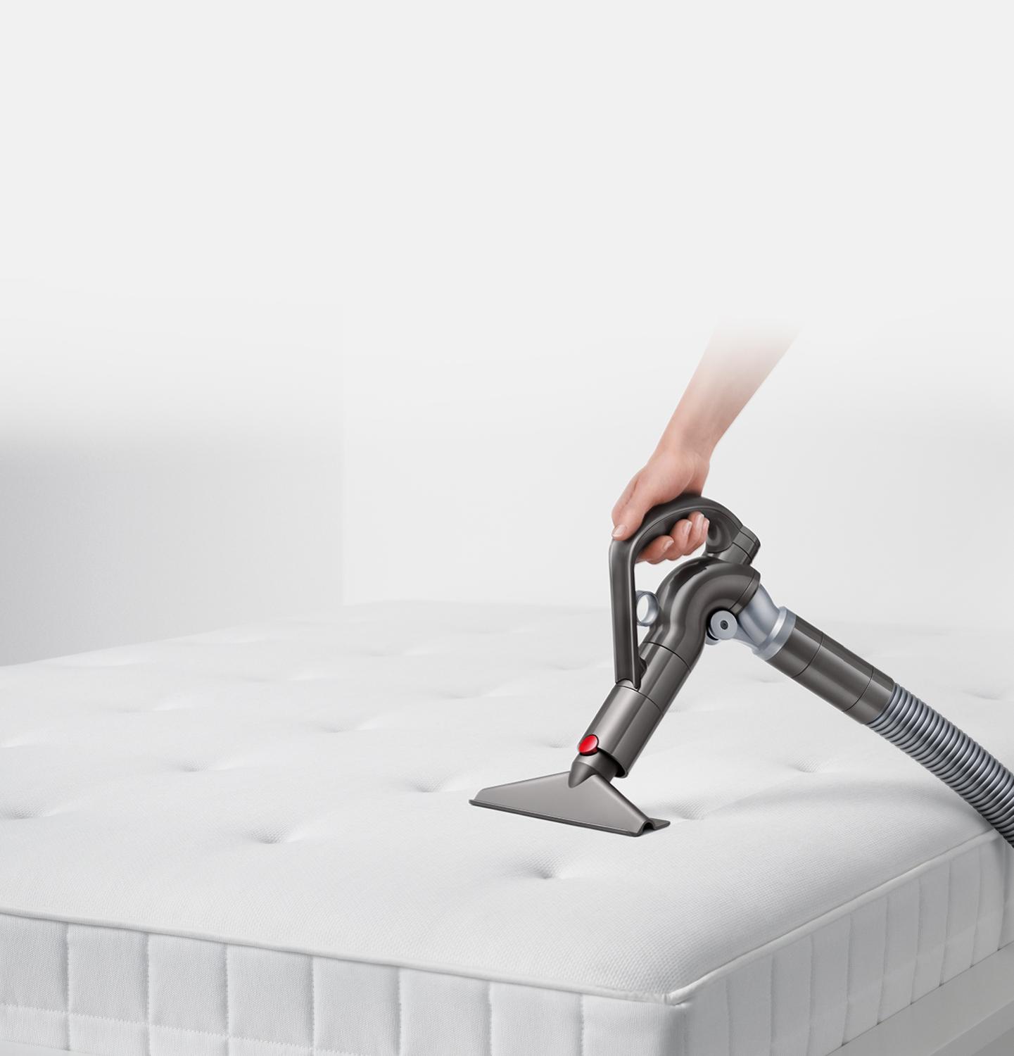 Quick-release wide nozzle tool being used on a mattress