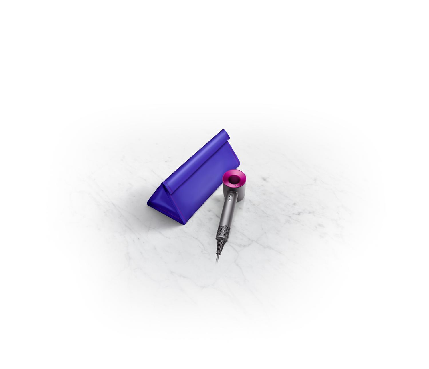 Cobalt blue storage bag with Dyson Supersonic™ hair dryer