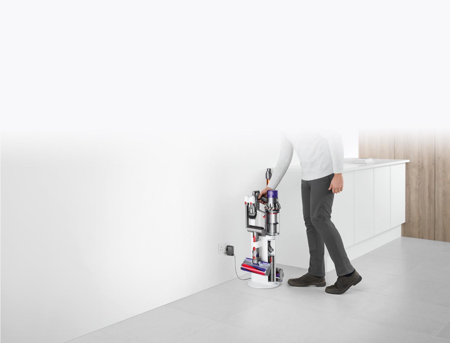 Dyson Cyclone V10 Dok™ plugged into wall