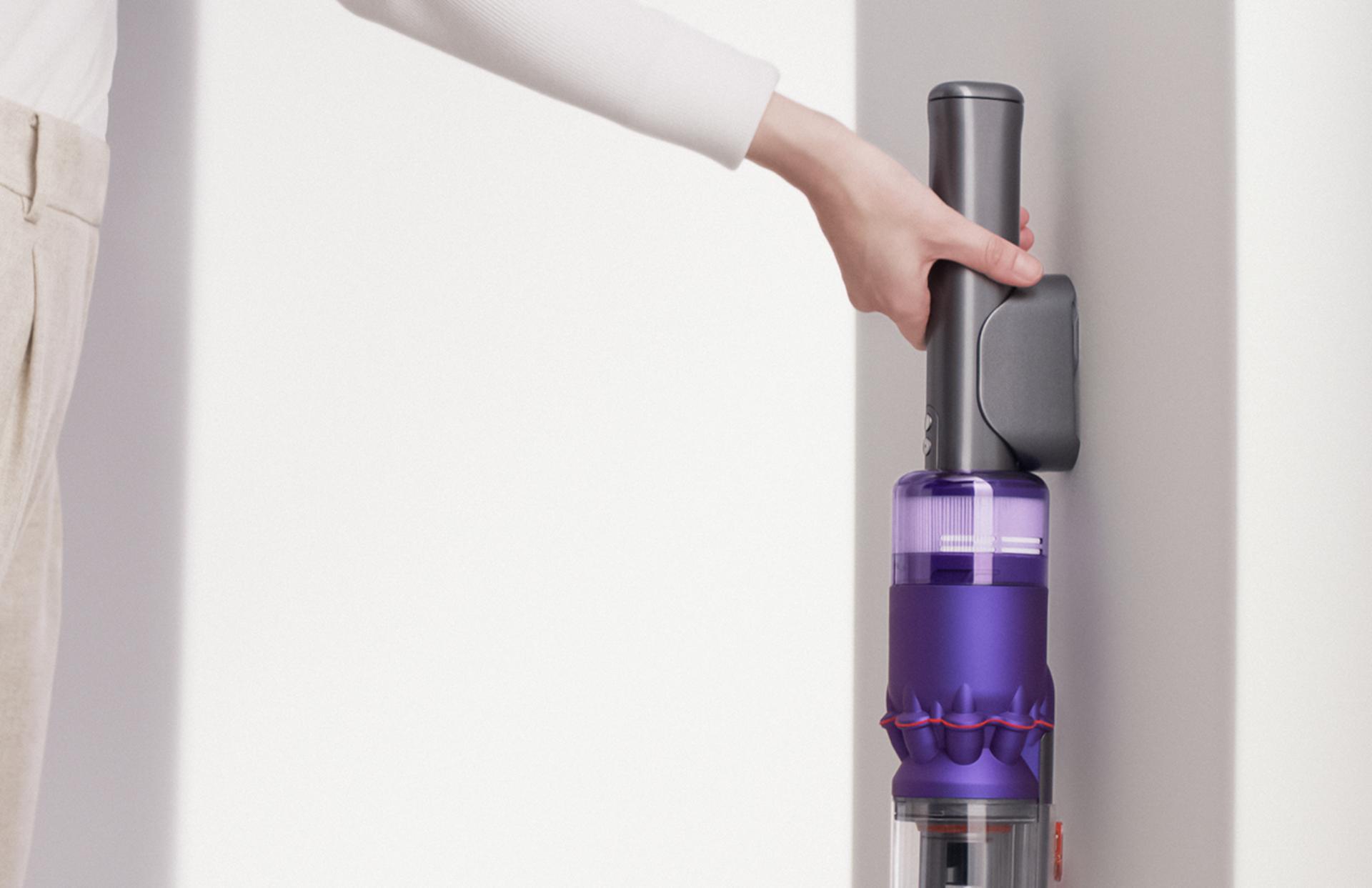 Dyson Omni-glide™ vacuum being placed into wall dock.