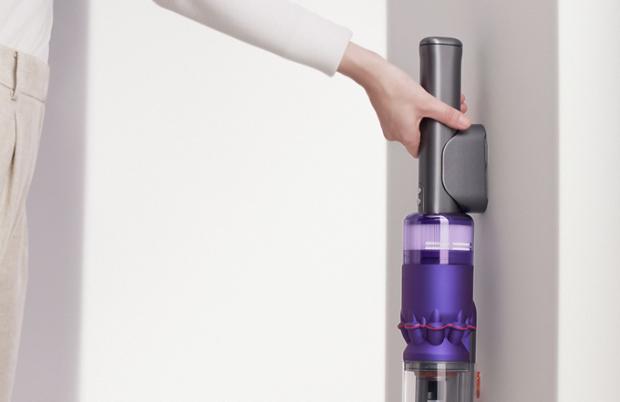 Dyson Omni-glide™ vacuum being placed into wall dock.