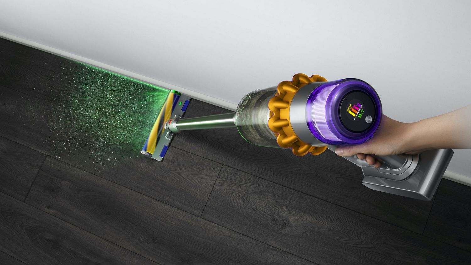 Close-up of hand holding the Dyson V15 Detect vacuum