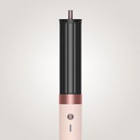 The Dyson Airwrap Co-anda2x multi-styler and dryer with the 30mm Co-anda2x barrel used by a blonde model to curl her hair.