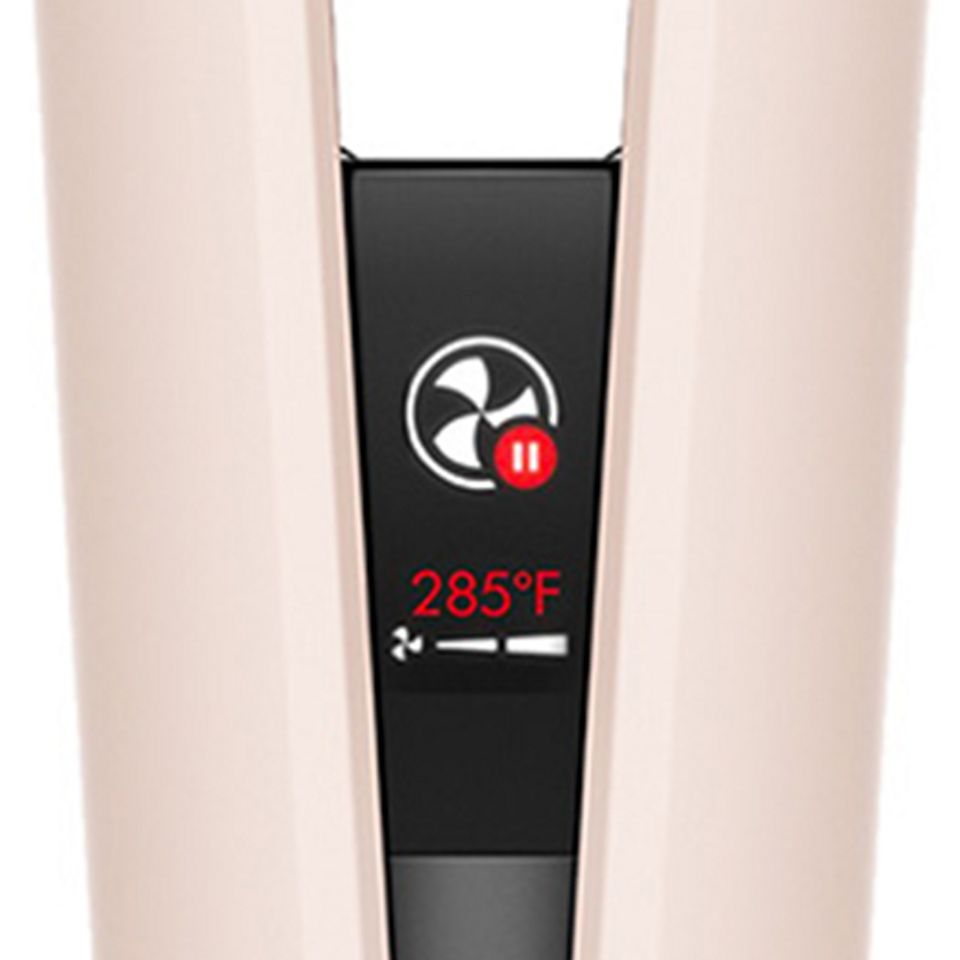 Close-up of the Dyson Airstrait's LCD screen showing the device has automatically paused. The Dyson Airstrait's LCD screen showing the device has automatically paused.