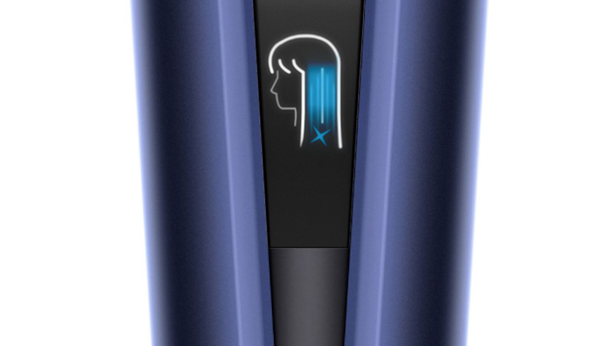 Close-up of the Dyson Airstrait's LCD screen showing Cool mode.