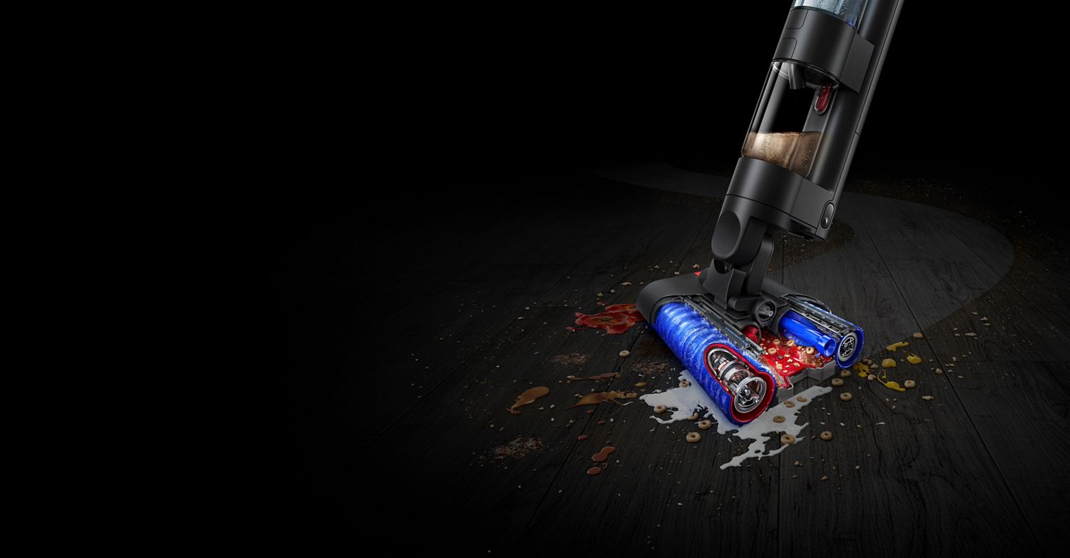 The Dyson WashG1 cleaning debris and spills on a hard floor