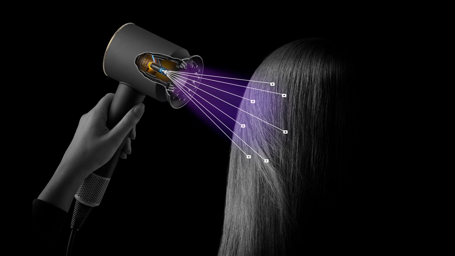 The Dyson Supersonic Nural hair dryer shown sensing the distance from a model's scalp.