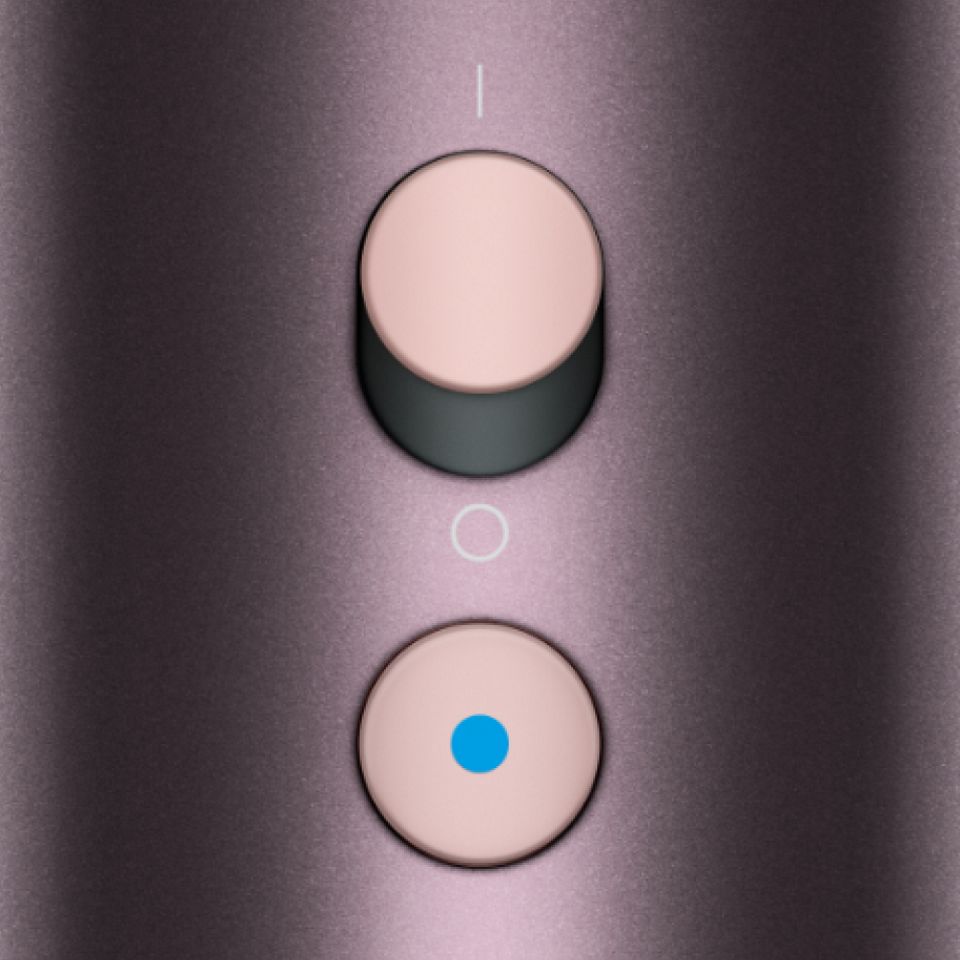 The power and Cold-shot buttons on the Dyson Supersonic Nural hair dryer.