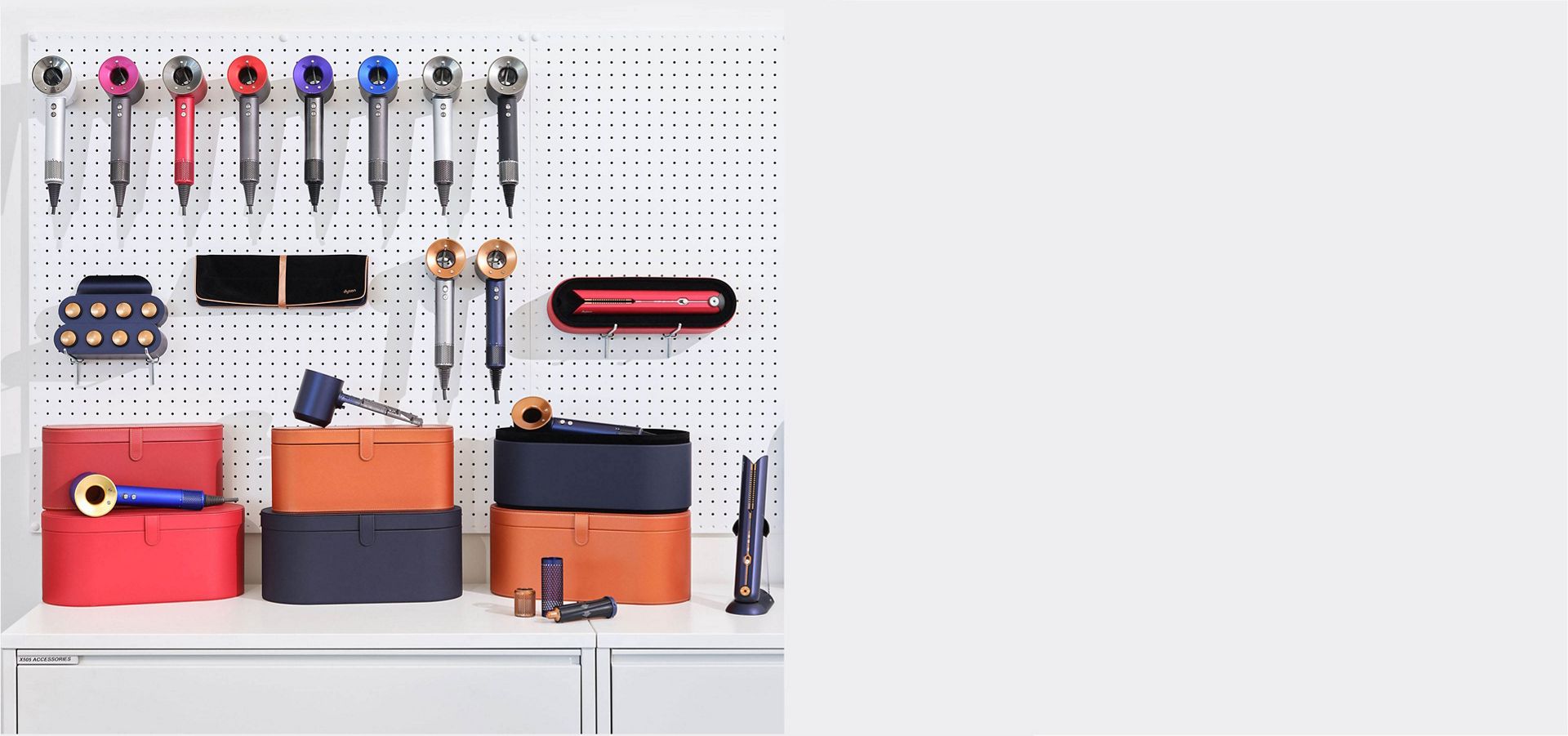 A wall of Dyson Supersonics in various colours.