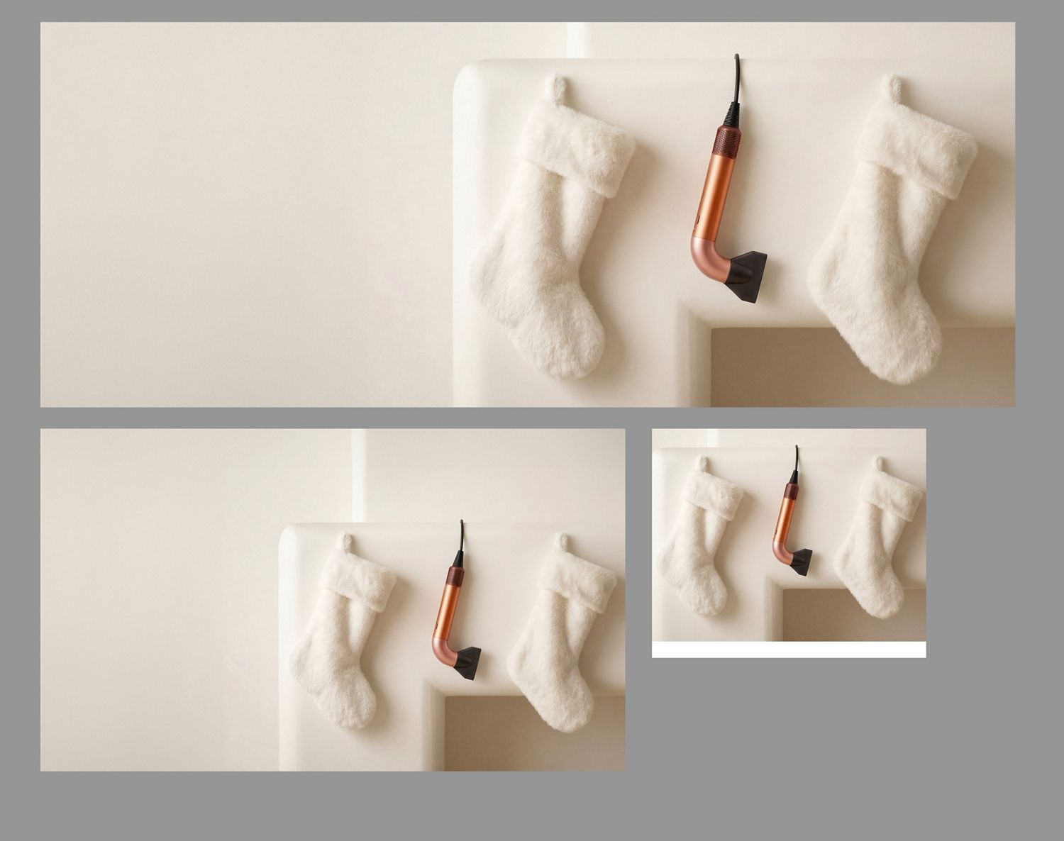 The Dyson Supersonic r hair dryer hanging in a line between a pair of Christmas stockings.