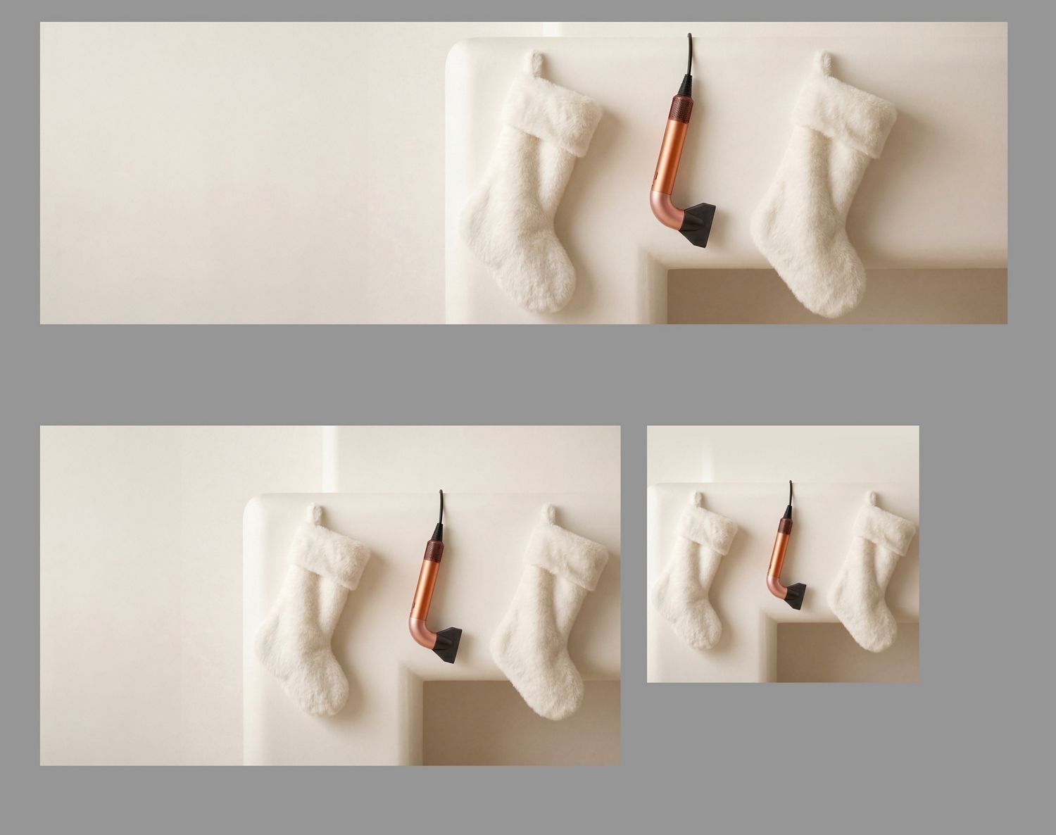 The Dyson Supersonic r hair dryer hanging in a line between a pair of Christmas stockings.