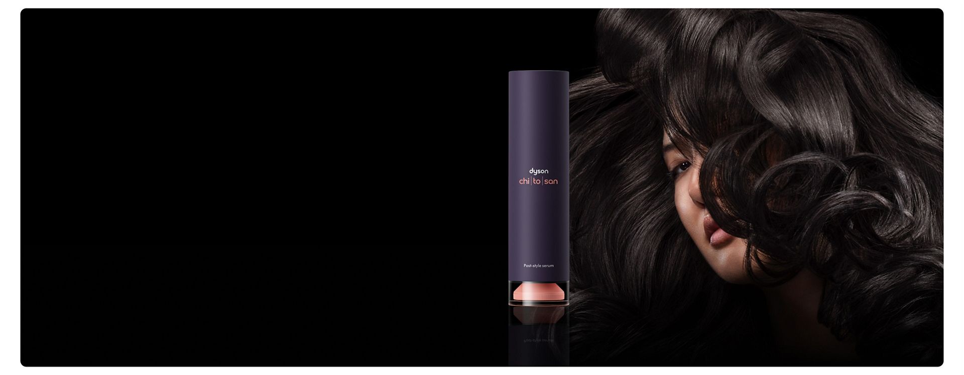 Dyson Chitosan Post-style serum next to a model with voluminous styled hair.