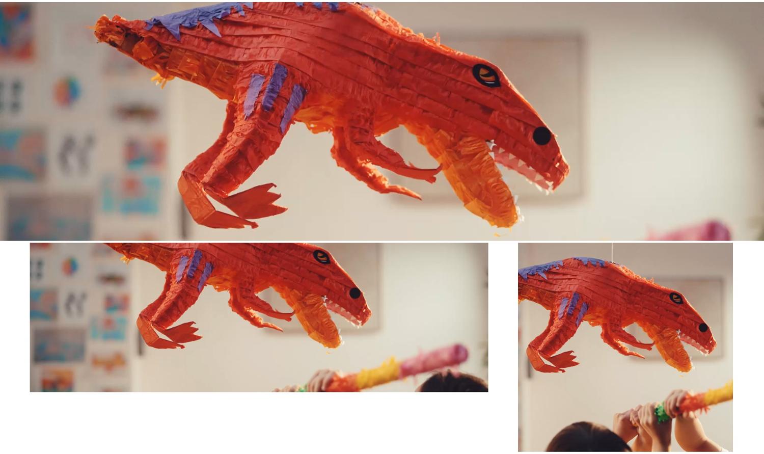 Confetti en snoepjes vallen uit een dinosaurus-piñata terwijl een moeder een draadloze Dyson stofzuiger uit het wandoplaadstation haalt.