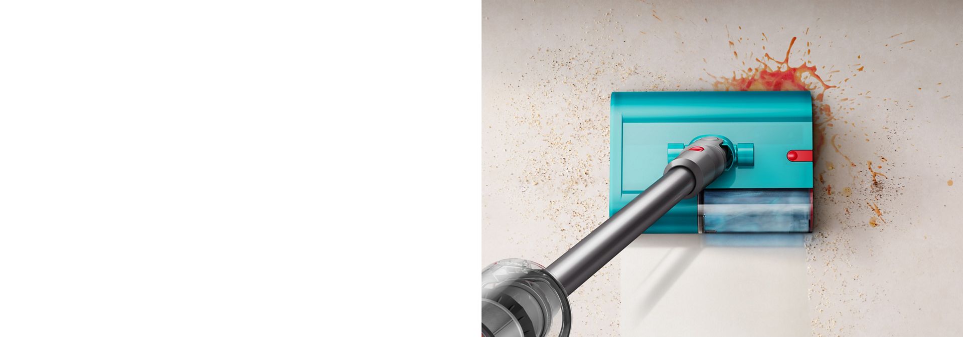 The Dyson Submarine wet cleaner head on a Dyson vacuum cleans a spill from a tiled floor.