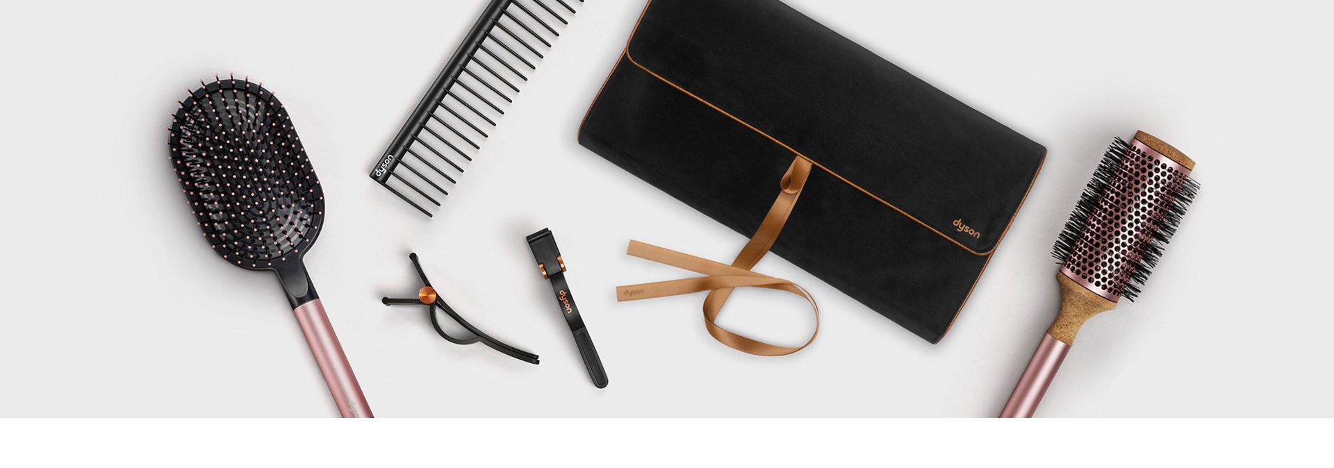 Dyson hair clips, round brush, paddle brush, comb and travel bag