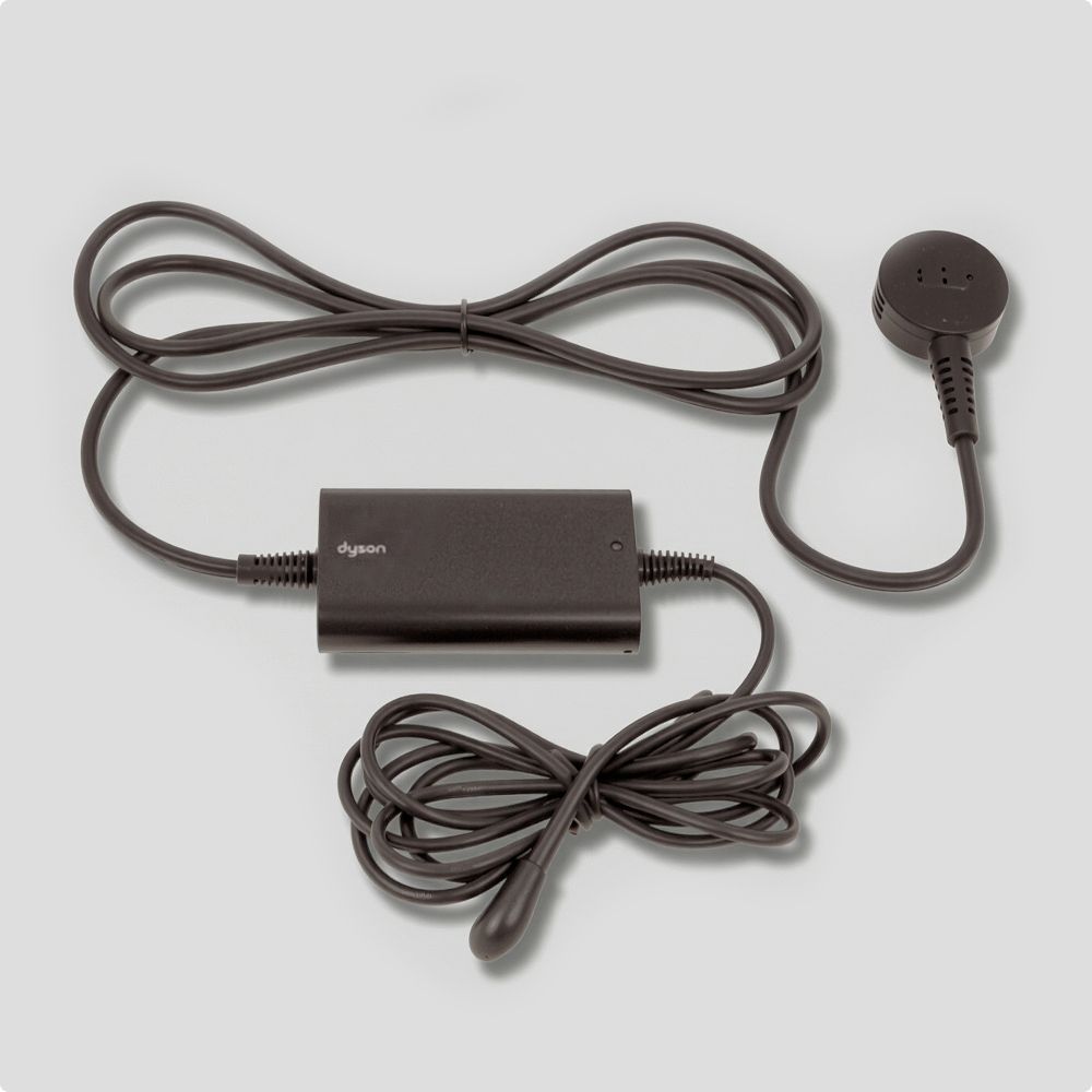 A black charger on a grey backround.