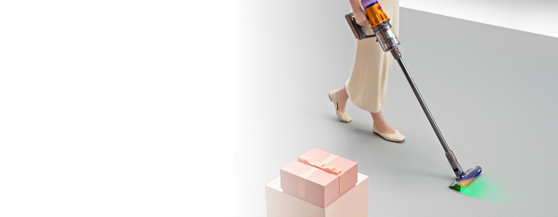 Dyson V12 Detect cordless vacuum used to clean dust and debris from a floor.