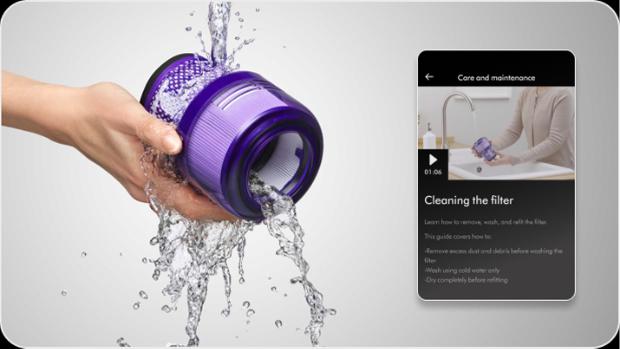 A Dyson vacuum filter is cleaned under running water while an app screen shows a guide on how to clean the filter.