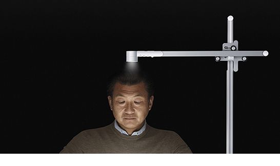 Man using a Dyson Lightcyle to perform a task