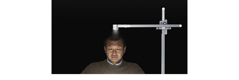 Man using a Dyson Lightcyle to perform a task