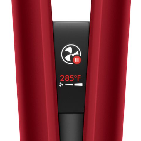 The LCD screen of the Dyson Airstrait straightener shows Auto-pause mode is active.