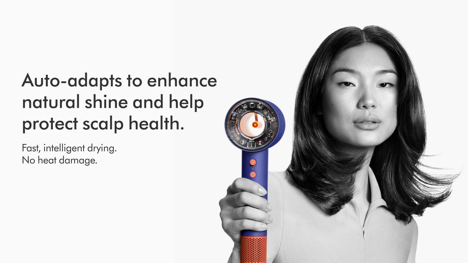 A model holding the Dyson Supersonic Nural hair dryer.