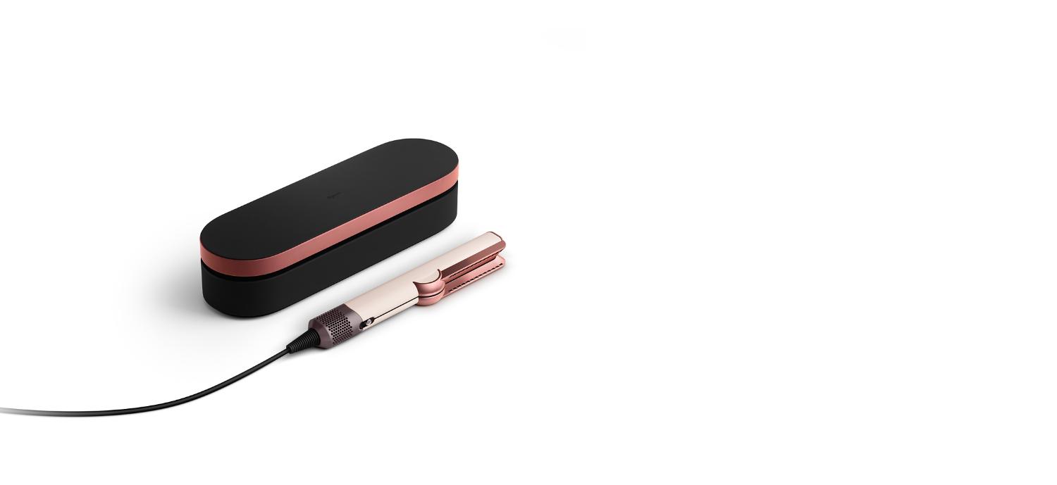 Dyson Airstrait straightener in Ceramic pink and rose gold with Onyx rose gold presentation case.
