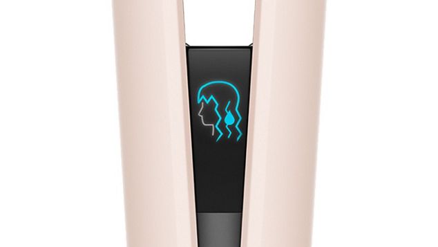 The LCD screen on the Dyson Airstrait showing an icon of someone with wet hair.