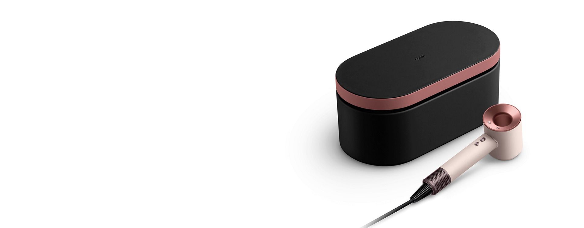 Dyson Supersonic hair dryer in Ceramic pink and rose gold and presentation case in Onyx rose gold.