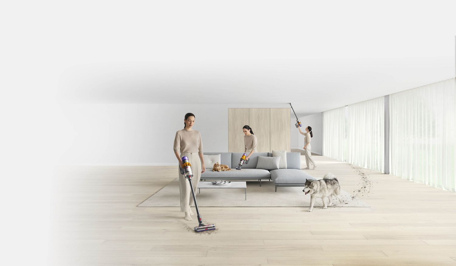 Woman using a Dyson cordless vacuum at various points around a living space, demonstrating the versaitility of Dyson cordless technology.