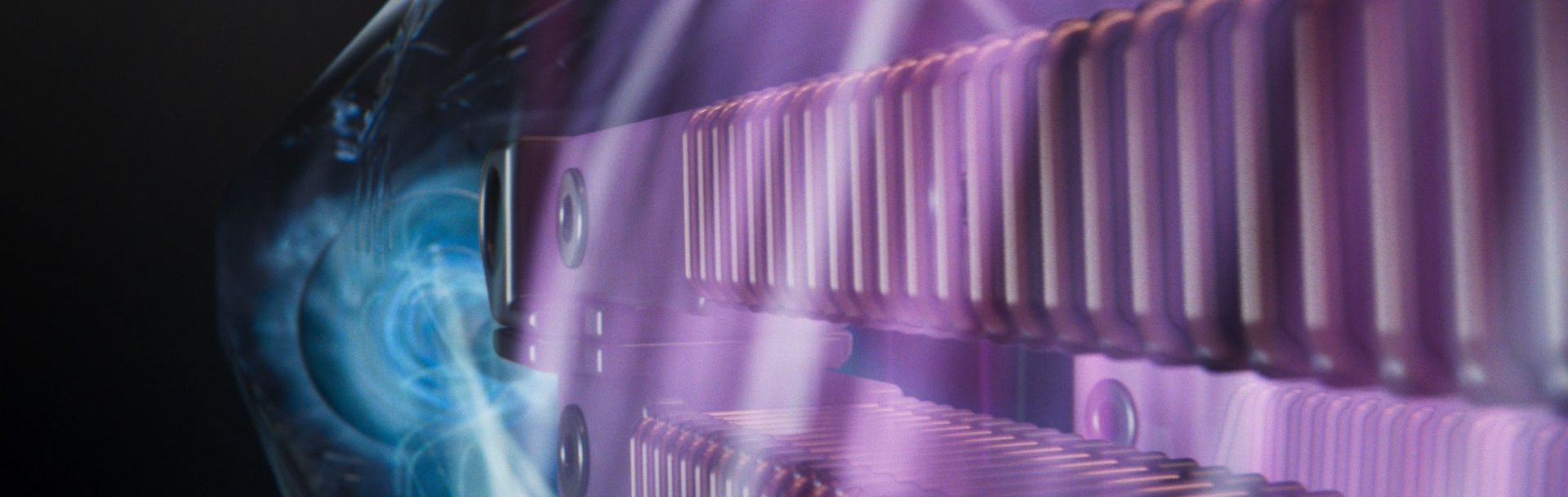 An animation of airflow, visualised in vibrant pink and blue, moves through a cutaway of a machine.