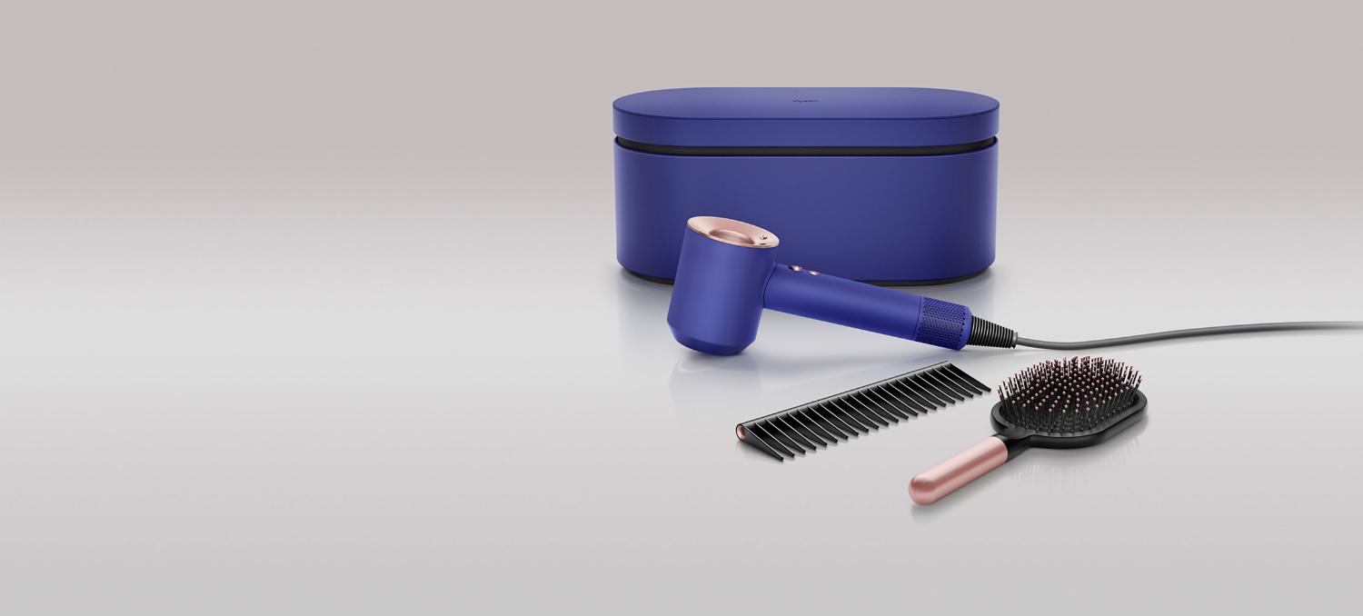 Dyson Supersonic hair dryer in Vinca blue and Rosé with presentation case, detangling comb and paddle brush.