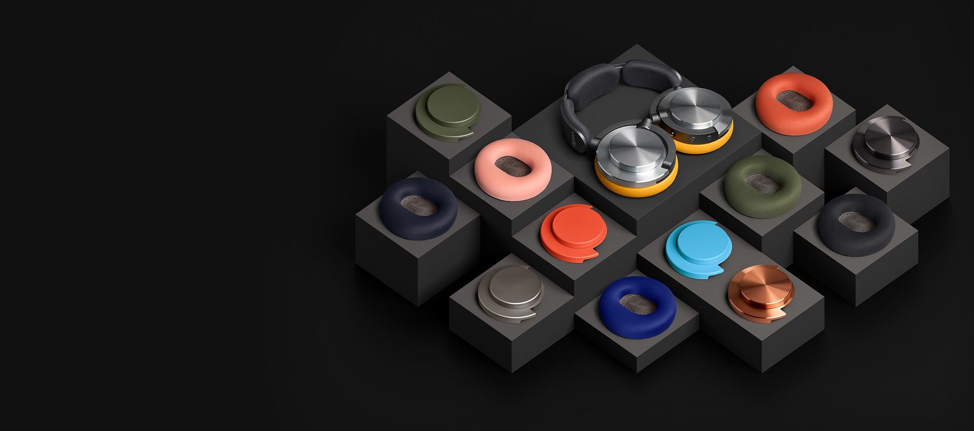 The Dyson OnTrac headphones with a selection of ear cushions and outer caps in different colourways.